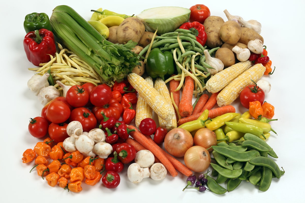 Fresh whole foods and grains in various stages of meal preparation